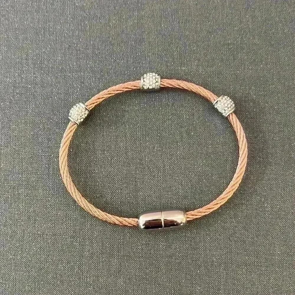 Copper and cubic zirconia bracelet with magnetic closure clasp.